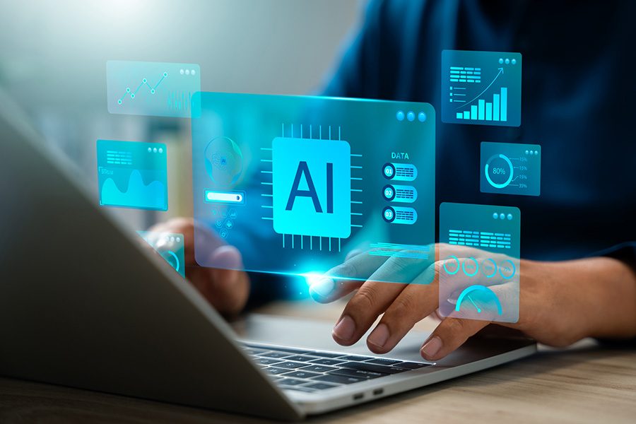 Someone at their laptop with AI graphics superimposed on their typing hands.