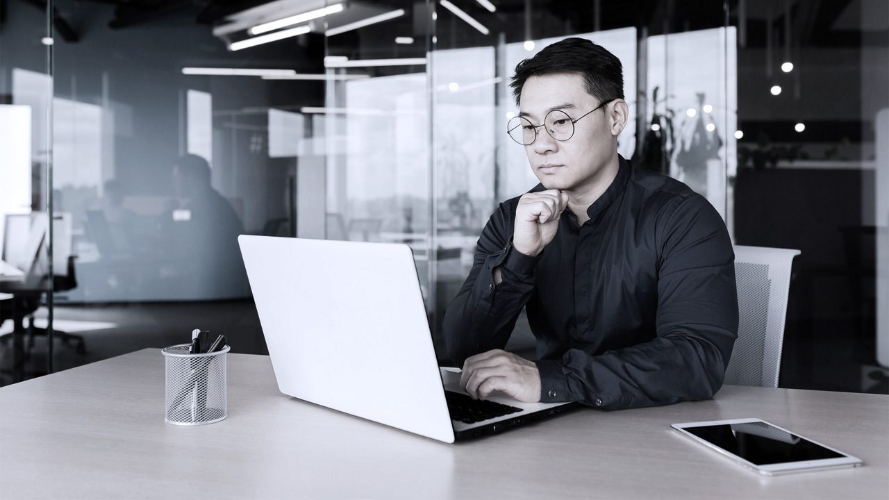 Man sitting in front of laptop
