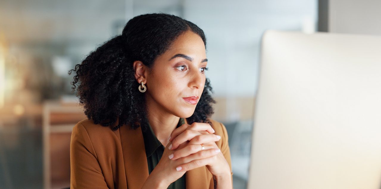 Worker looks intently at a computer screen