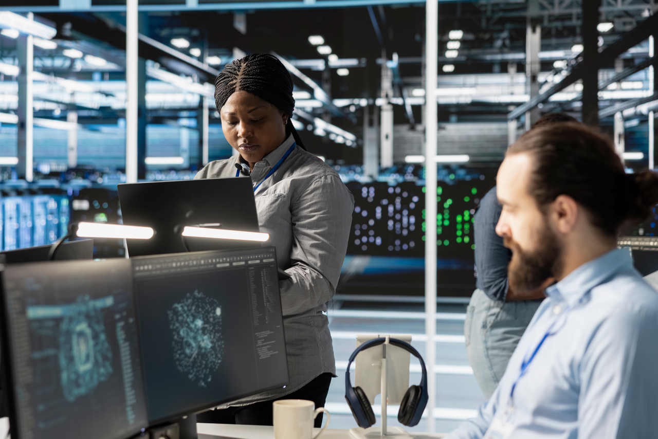Engineers doing maintenance on blade servers supplying compute power for AI data processing and inference workloads. IT experts overseeing data center arrays managing training datasets
