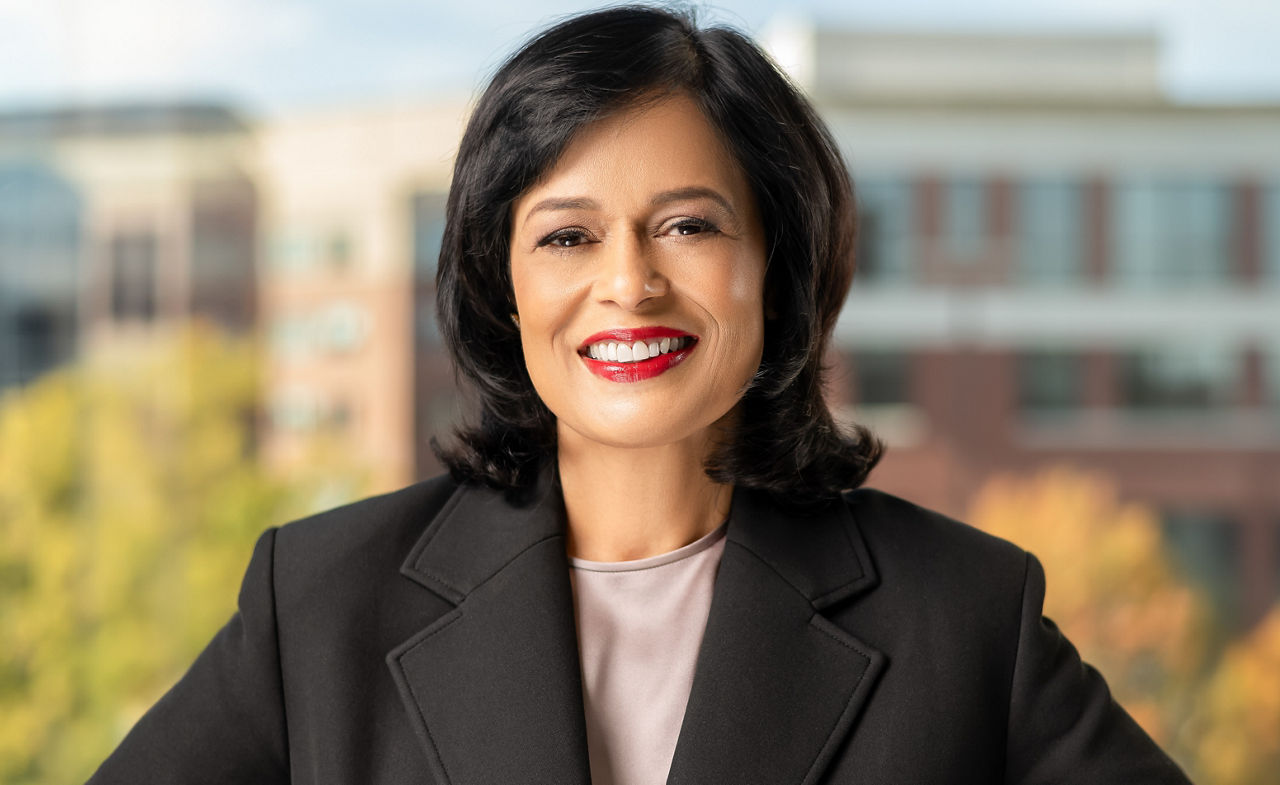 hands of varying colors meeting in the middle of a group 