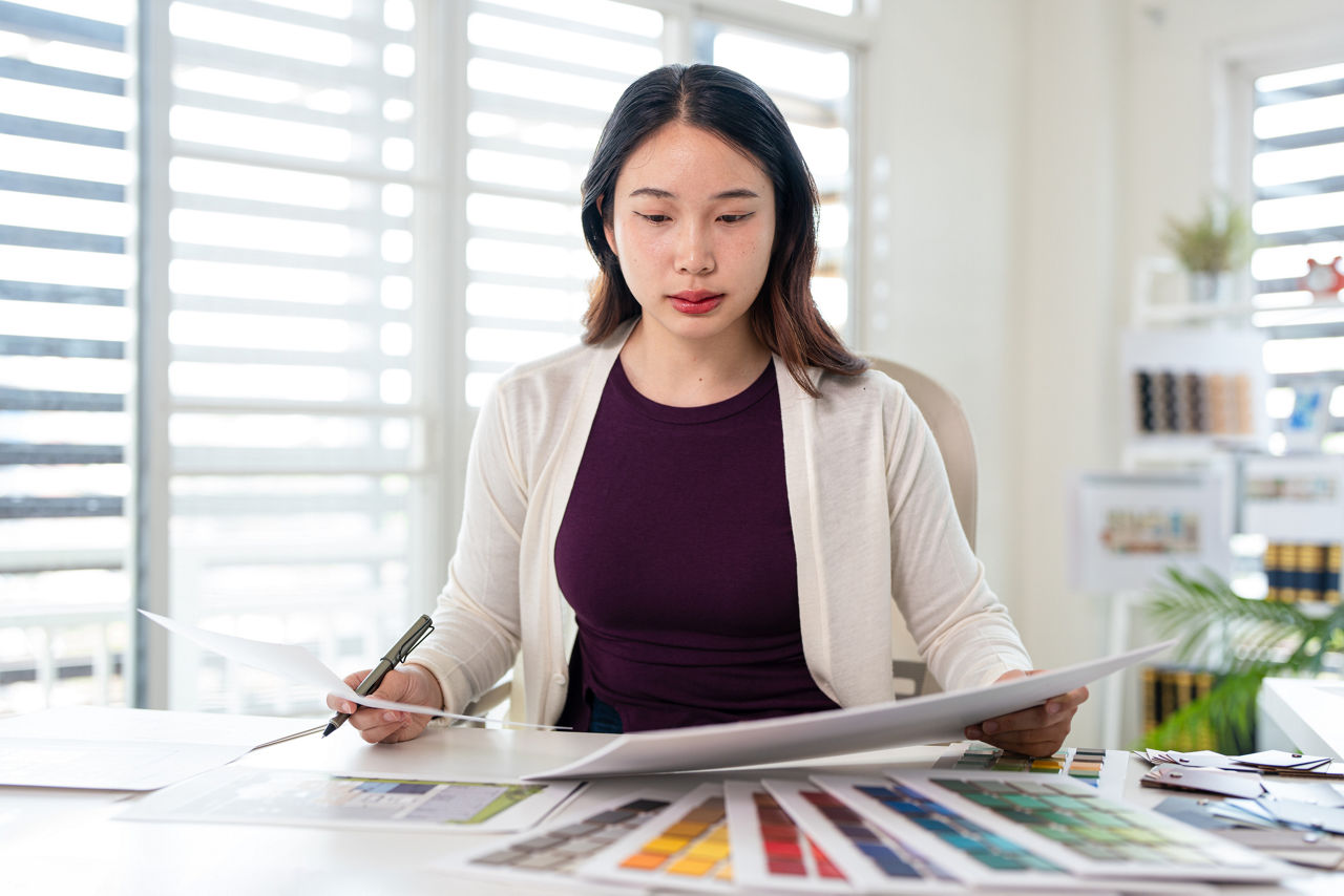 Interior design, working  designers or decorator choosing finishing material , women considering about material samples.