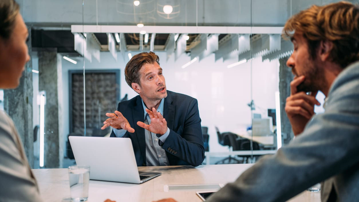 A group of business people having a meeting in an office.