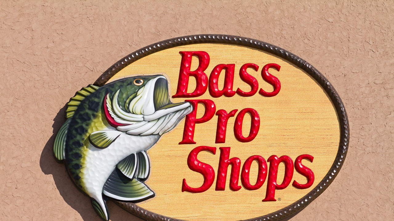 A sign for bass pro shops on the side of a building.