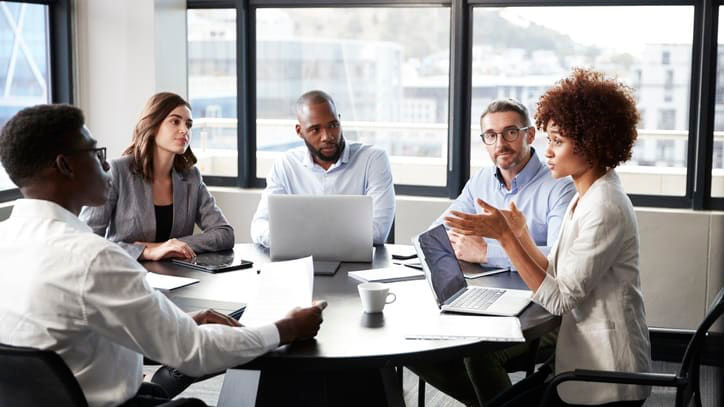 A group of business people having a meeting in a conference room.