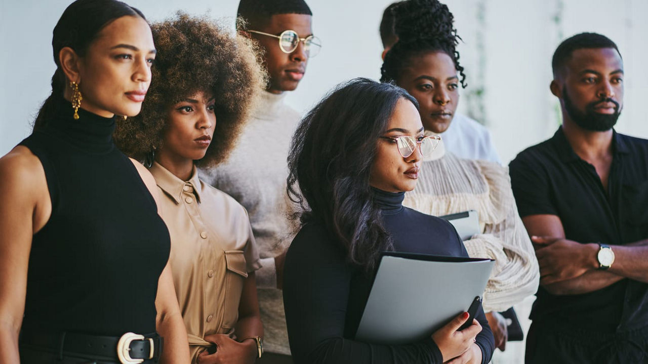 A group of people standing in a line.