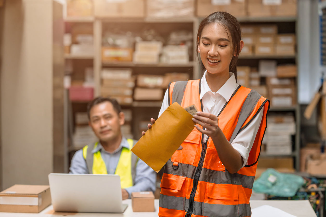 happy young women worker receive incentive bonus commission money from manager from good working
