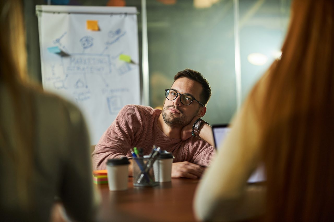 Man feeling bored during a meeting