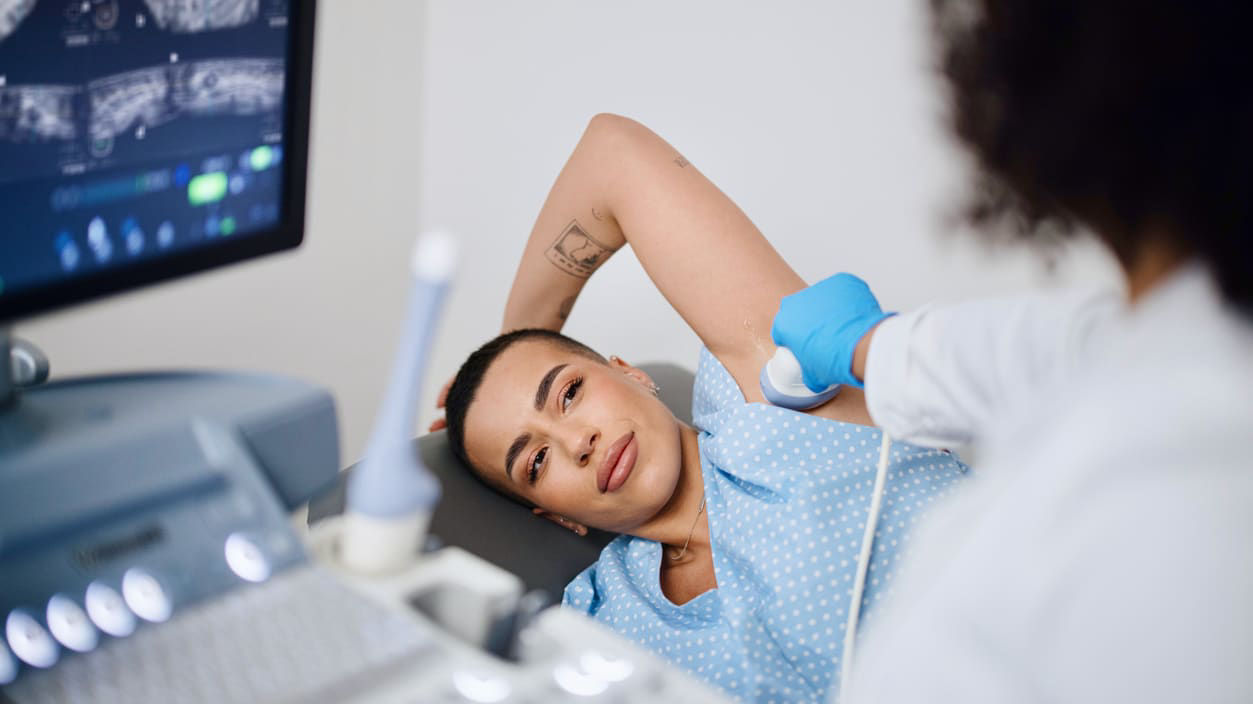 A woman is getting examined by a doctor.