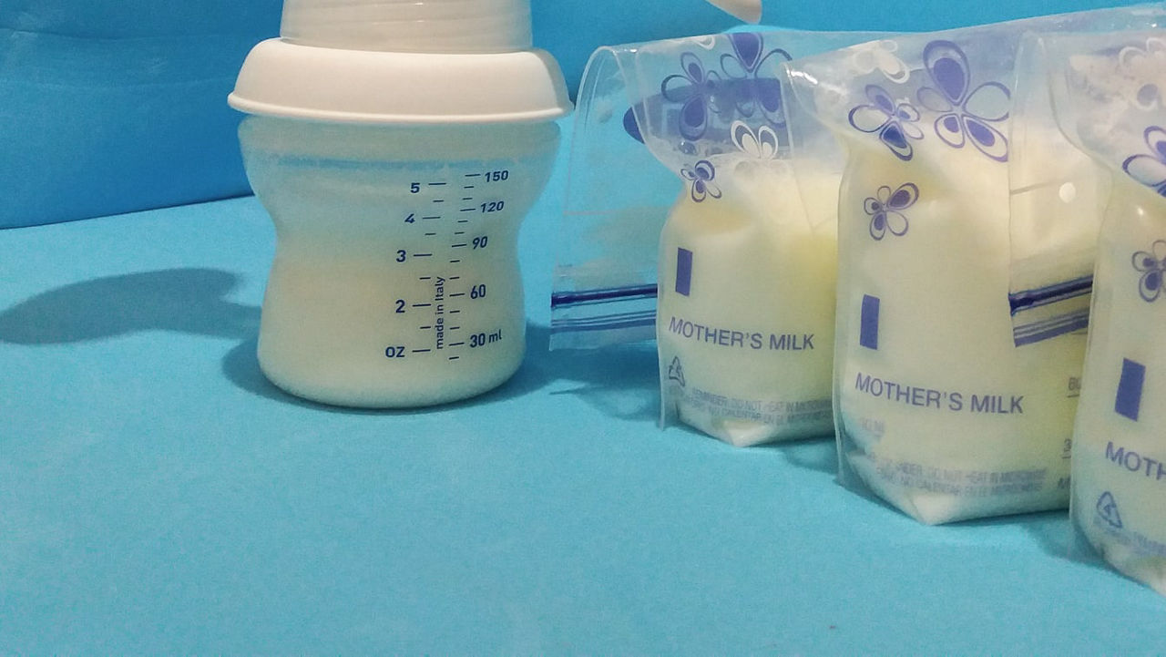 A bottle of milk next to a bottle of milk.