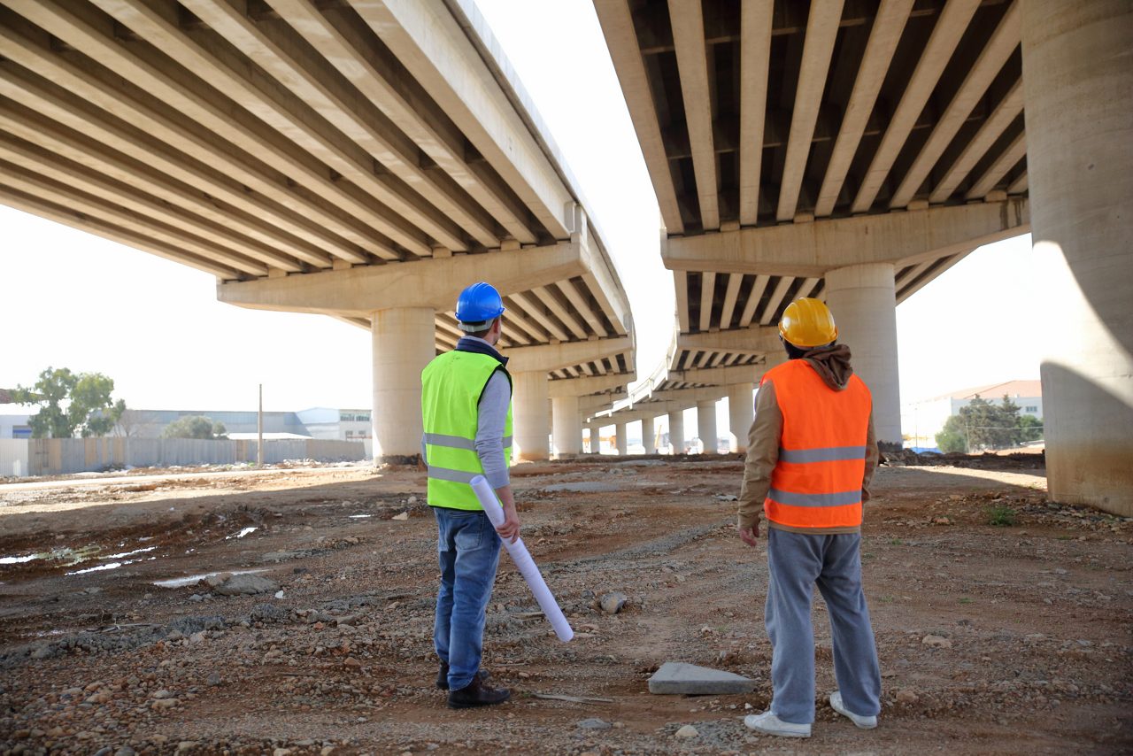 workers under bridge construction