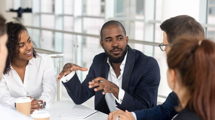 A group of business people having a meeting in an office.