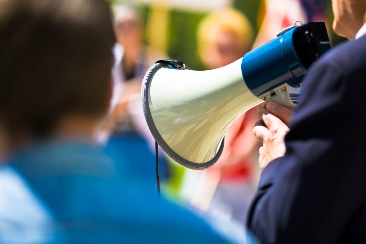 Man on a bullhorn