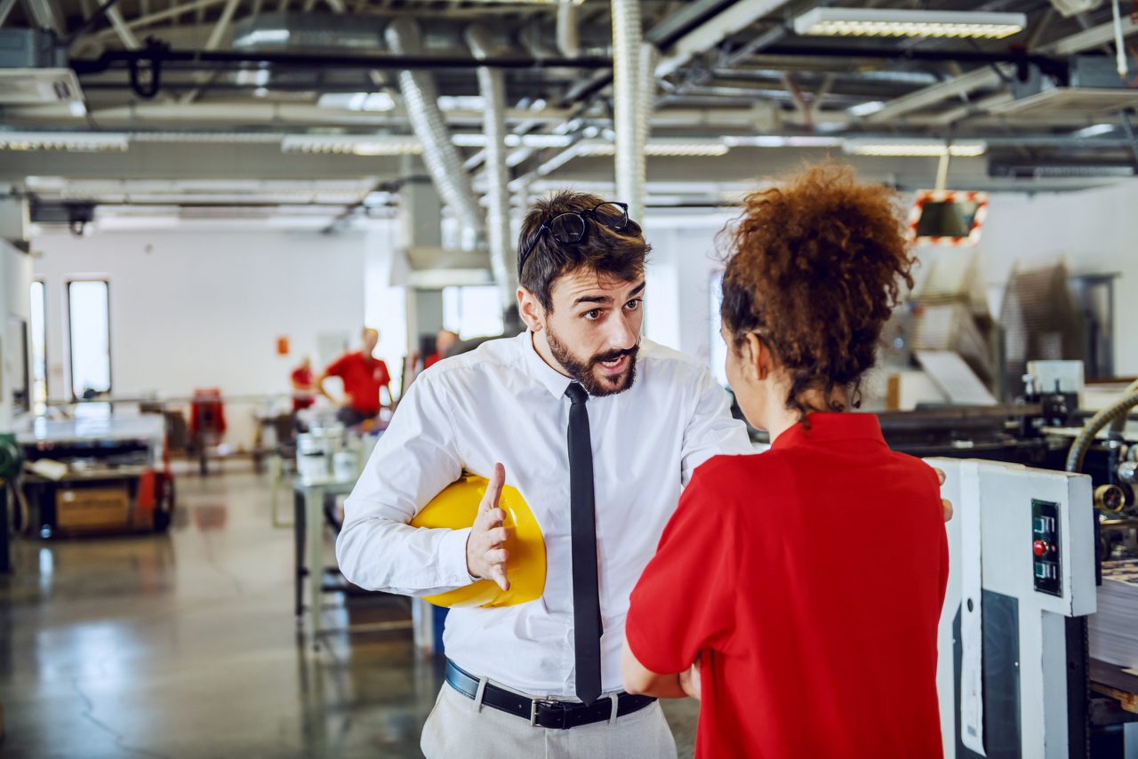 Man yells at co-worker on manufacturing floor