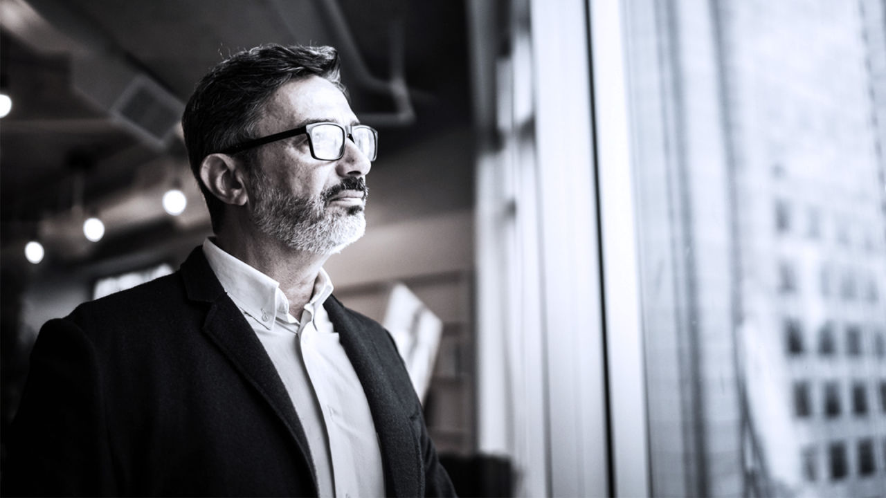 business person looking out window