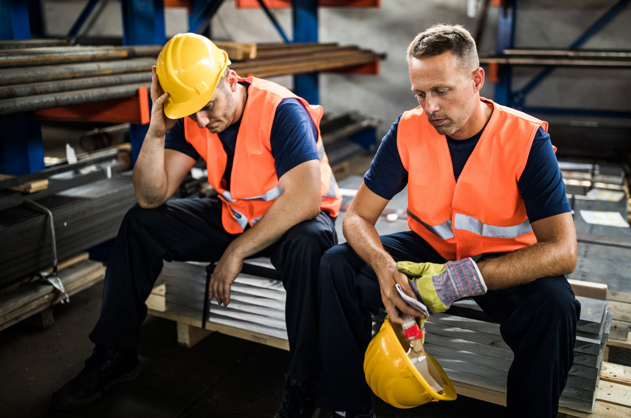Two metal workers received bad news while resting in aluminum mill.