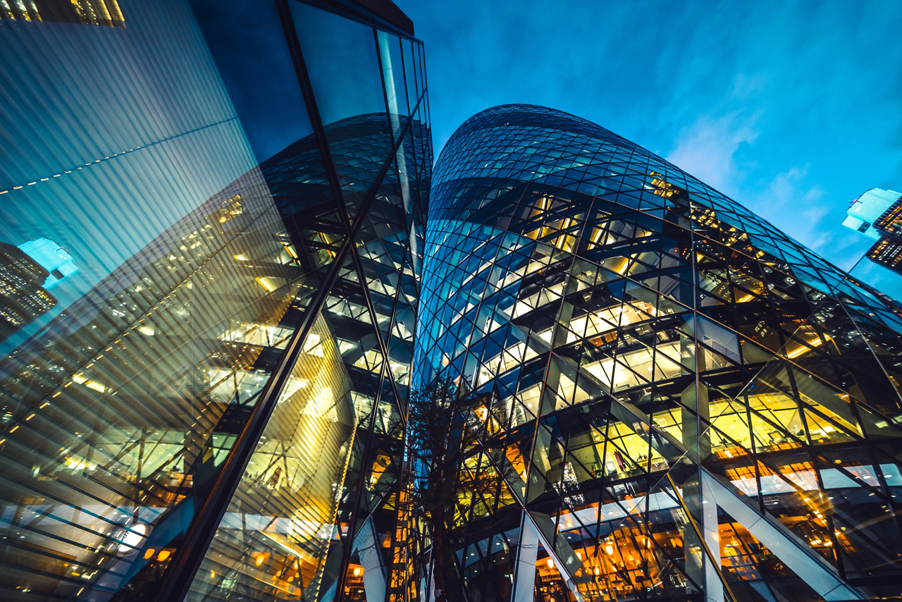 Looking directly up at the skyline of the financial district in central London