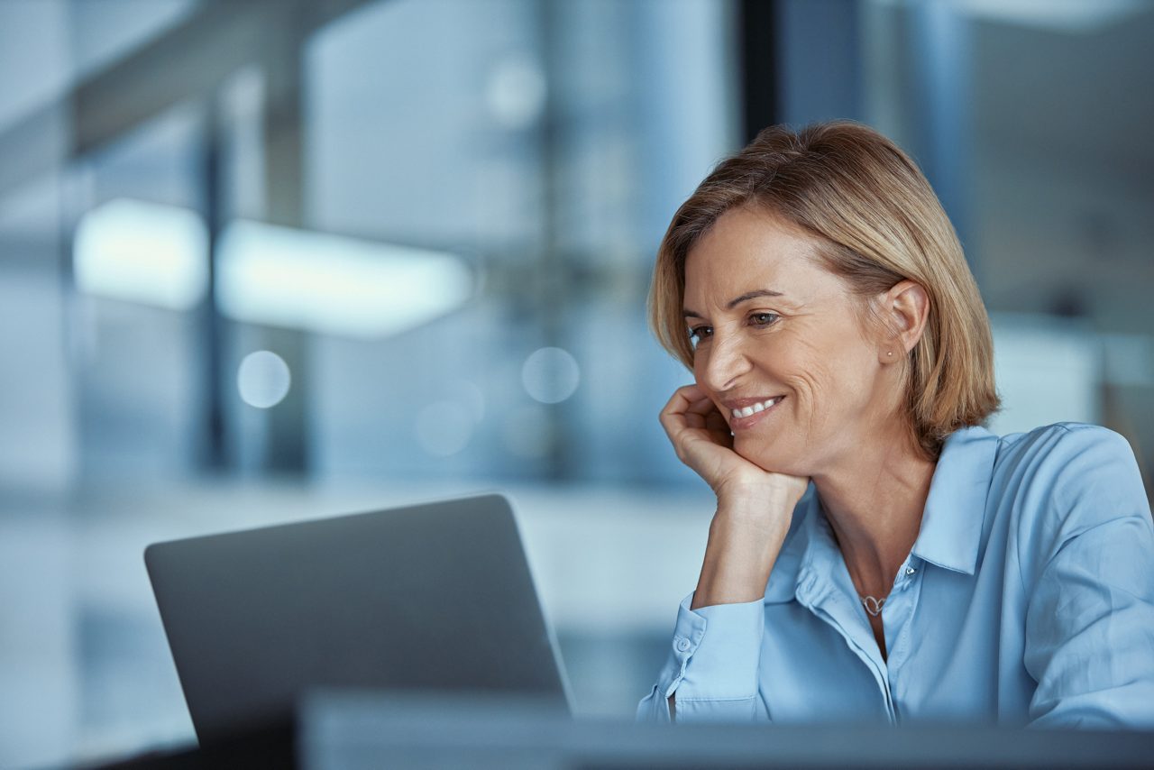 Shot of a mature businesswoman using a laptop in a modern office