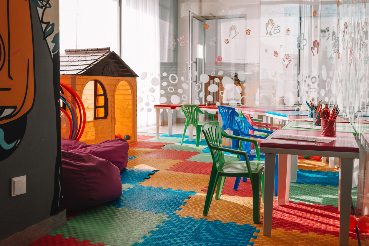 Chairs, table and toys. Interior of kindergarten. Kids play room.