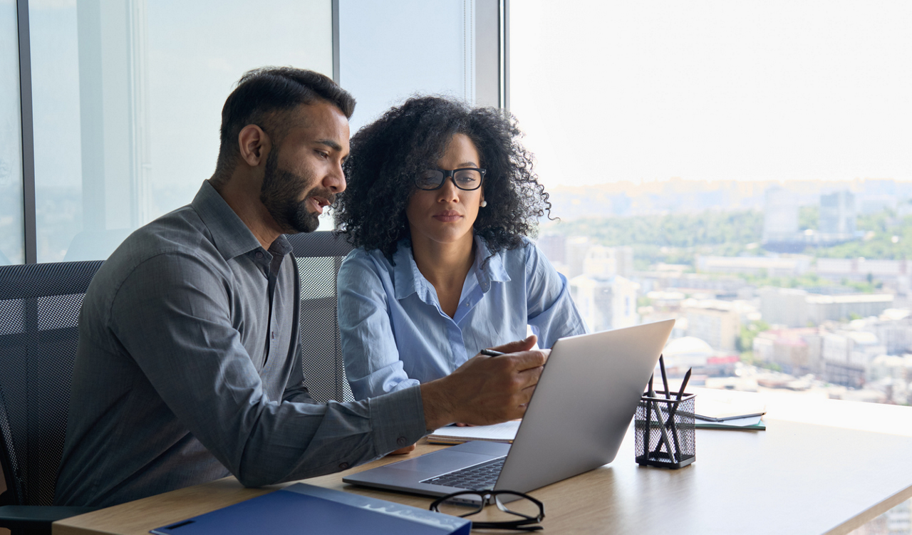 Manager giving feedback in coaching conversation to leader