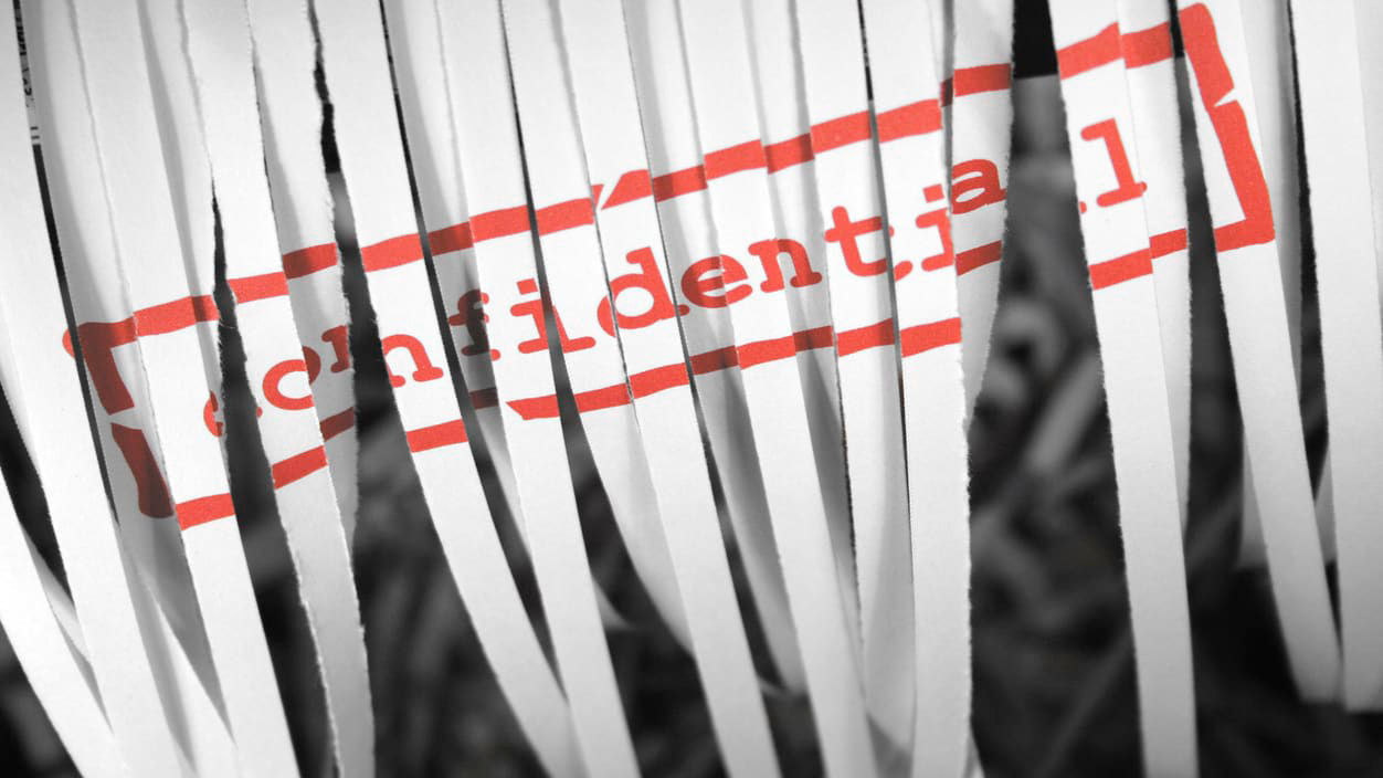 A black and white photo of a piece of paper with the word credential.