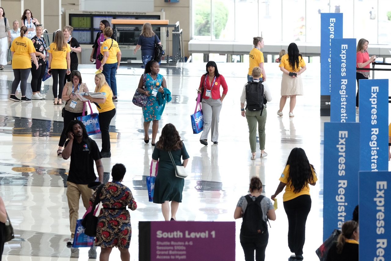 Attendees walk in the main hall at McCormick Place