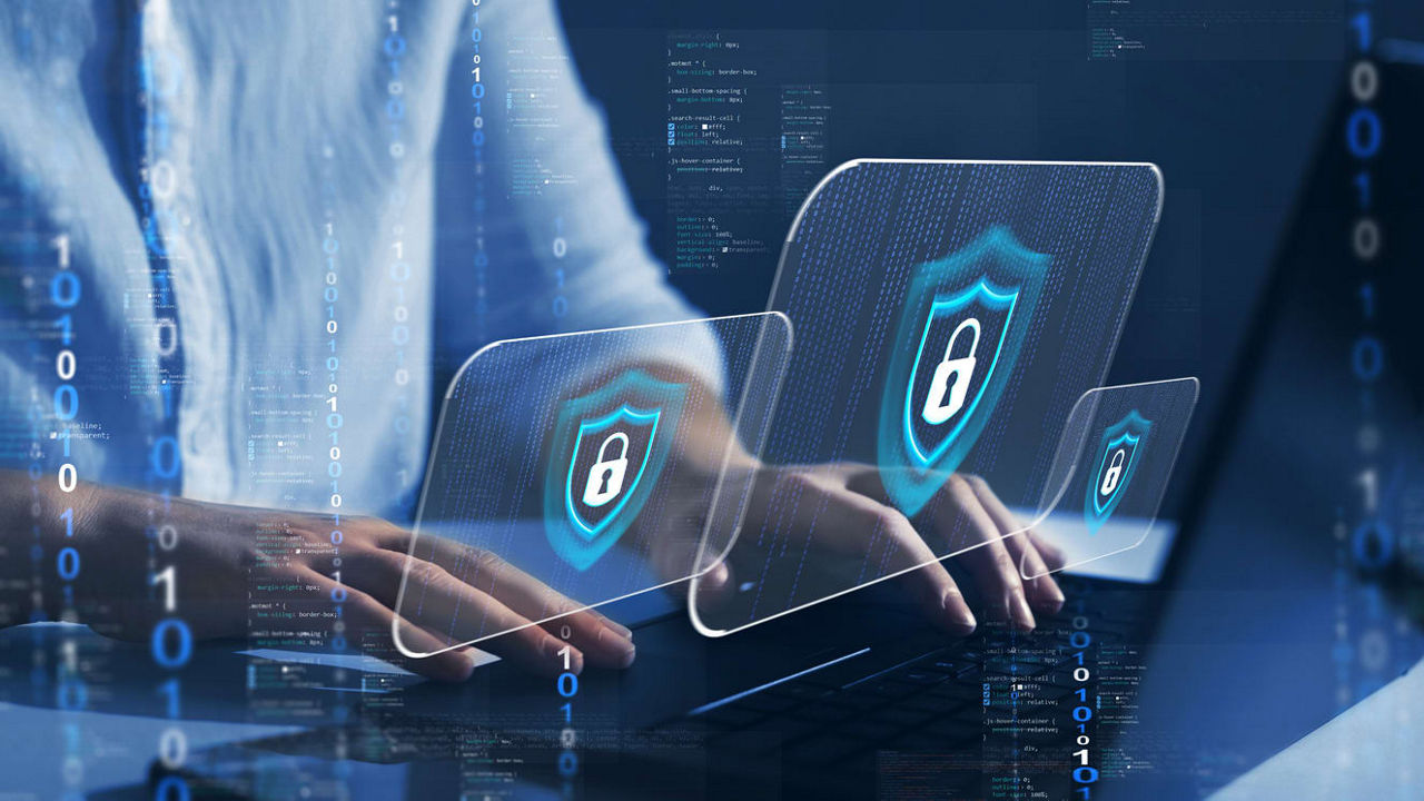 Someone typing on a a computer with graphics of three locks superimposed on computer