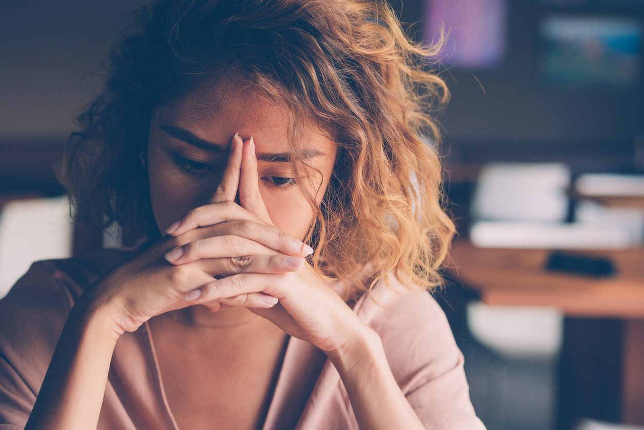 young female looking stressed and upset