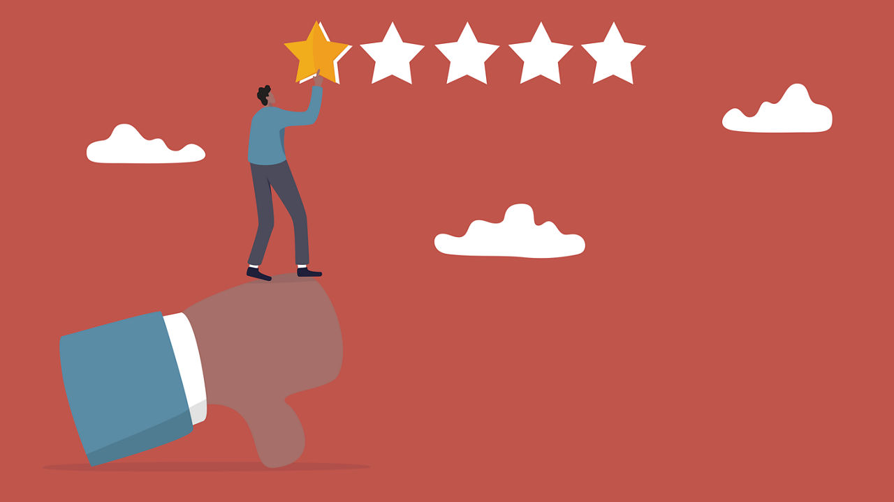 A man is standing on a person's hand with a star on it.