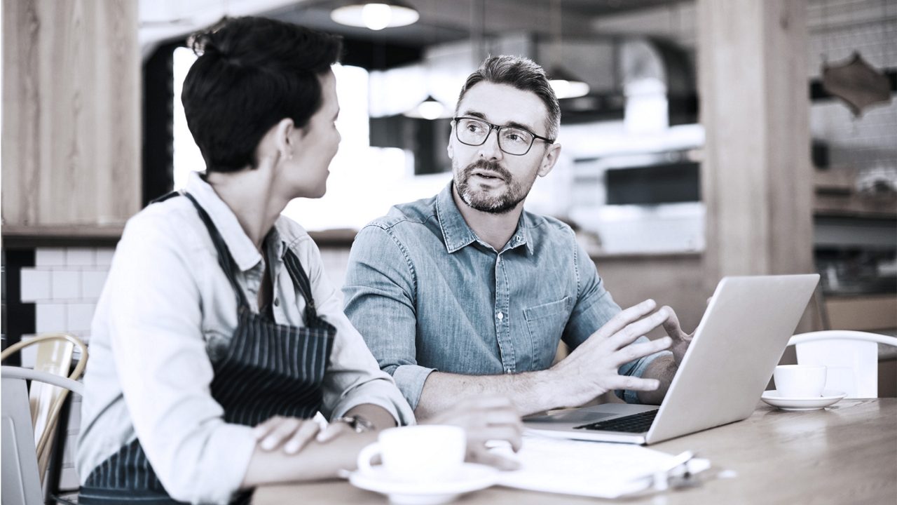 two people talking in an office