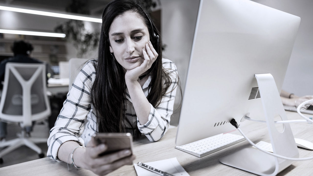 distracted employee on cell phone productivity loss