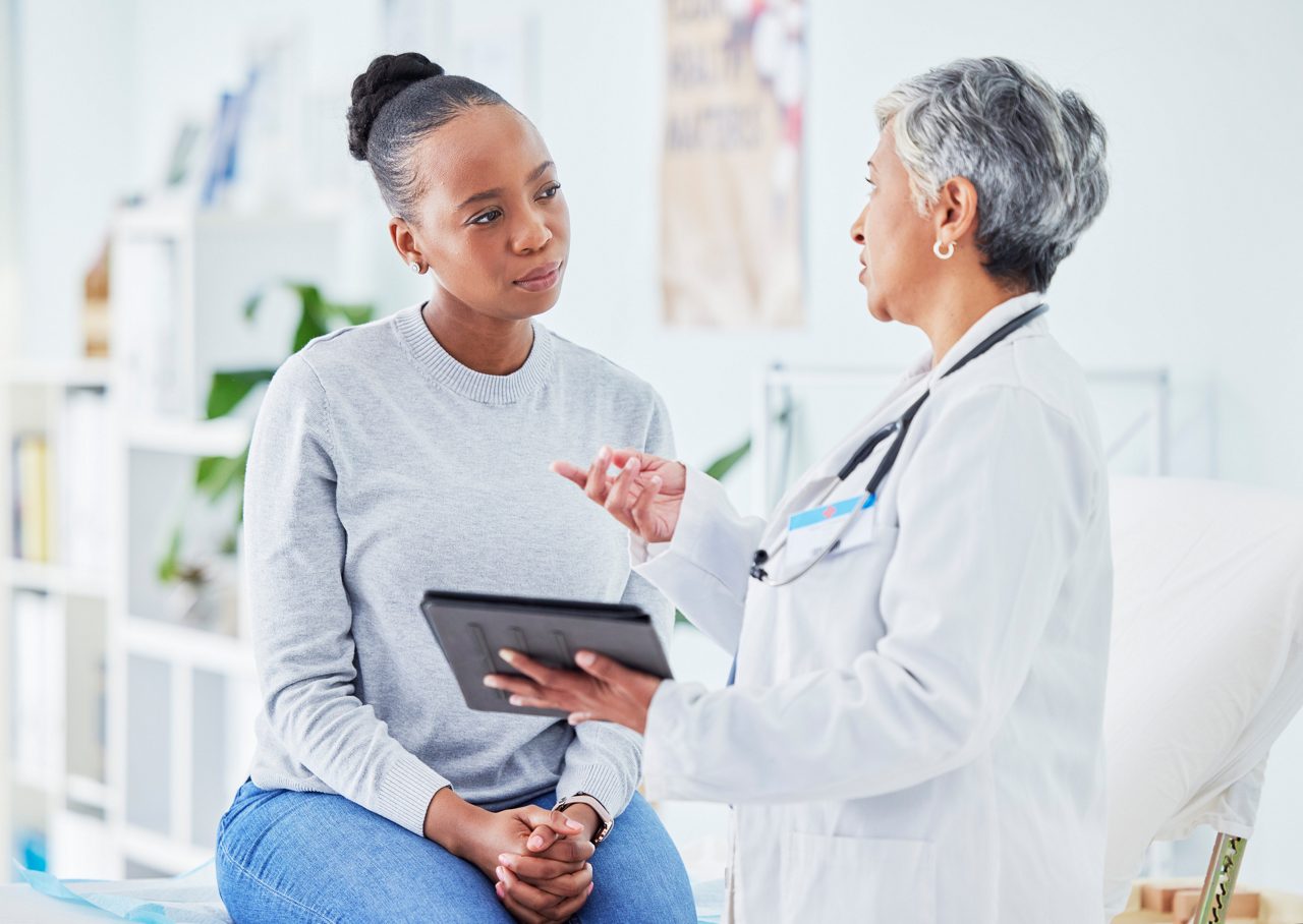 doctor conversing with patient
