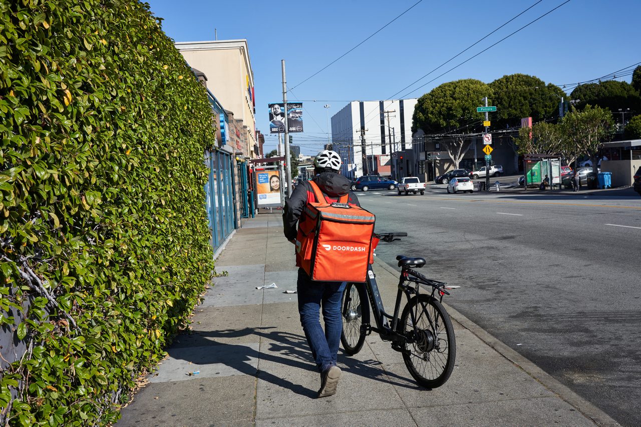 DoorDash delivery worker on bicycle