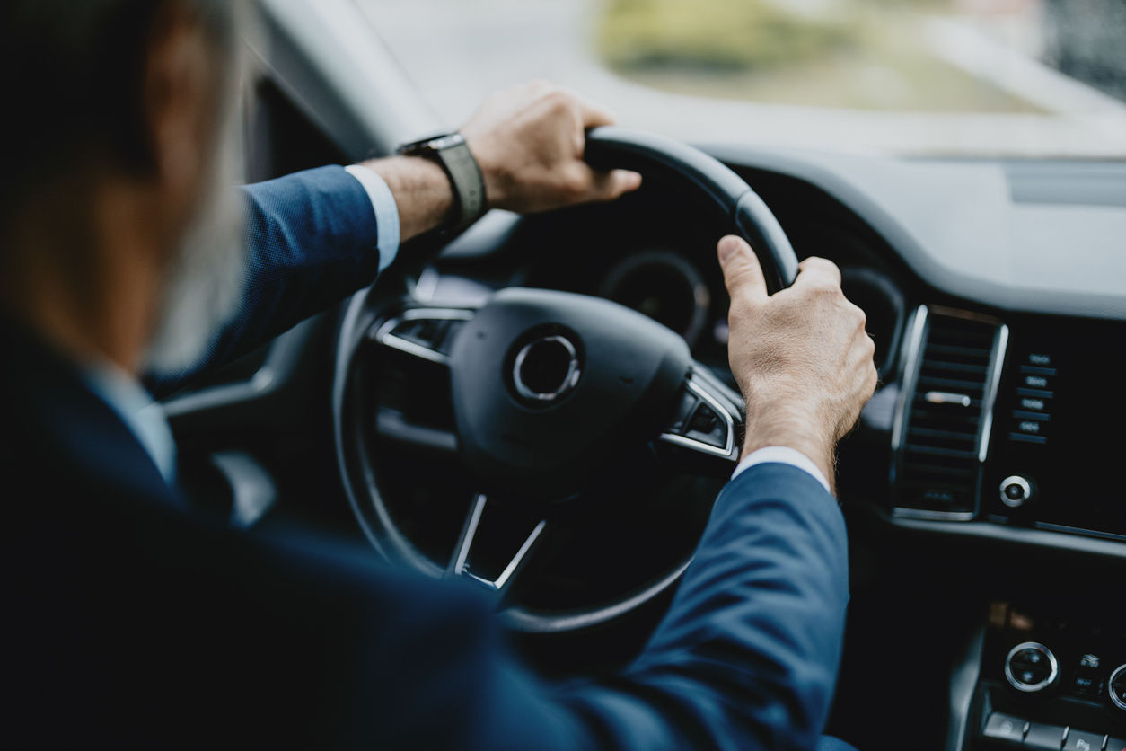 businessman driving a car