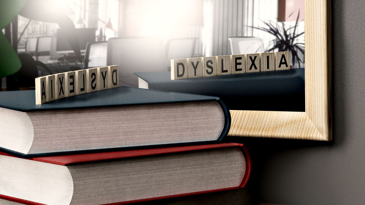 A stack of books with the word dyslexia written on them.