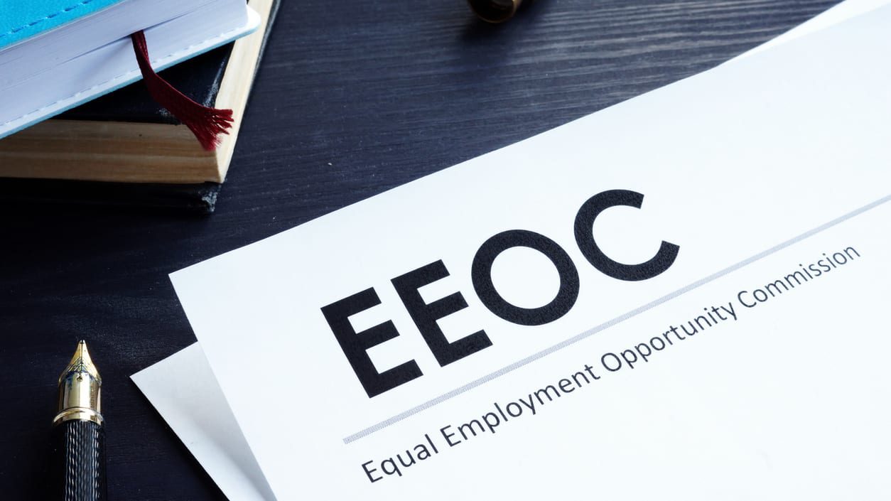 EEOC letterhead and a pen.