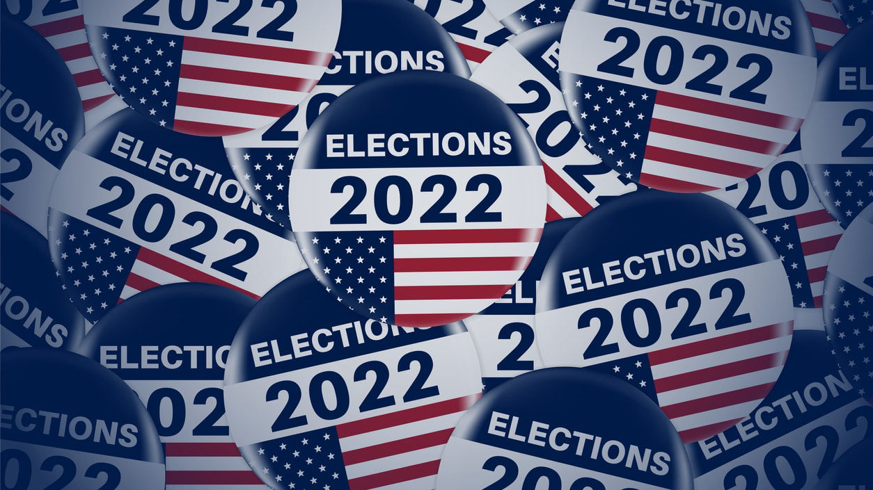 A group of election 2020 stickers on a blue background.