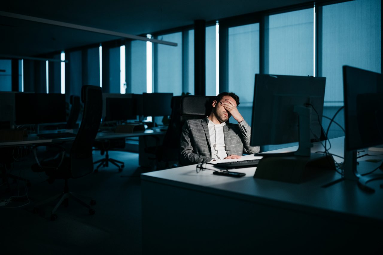employee in a dark office with low morale