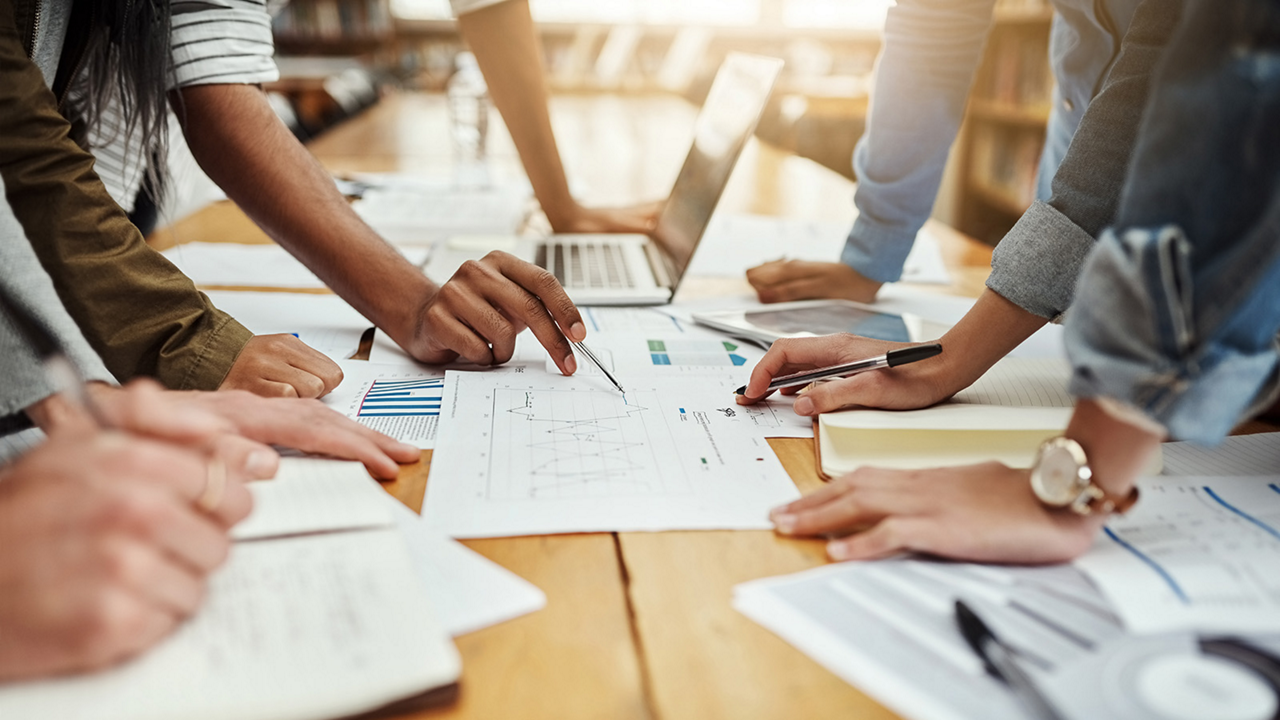 Employees Collaborating on a Project or Chart