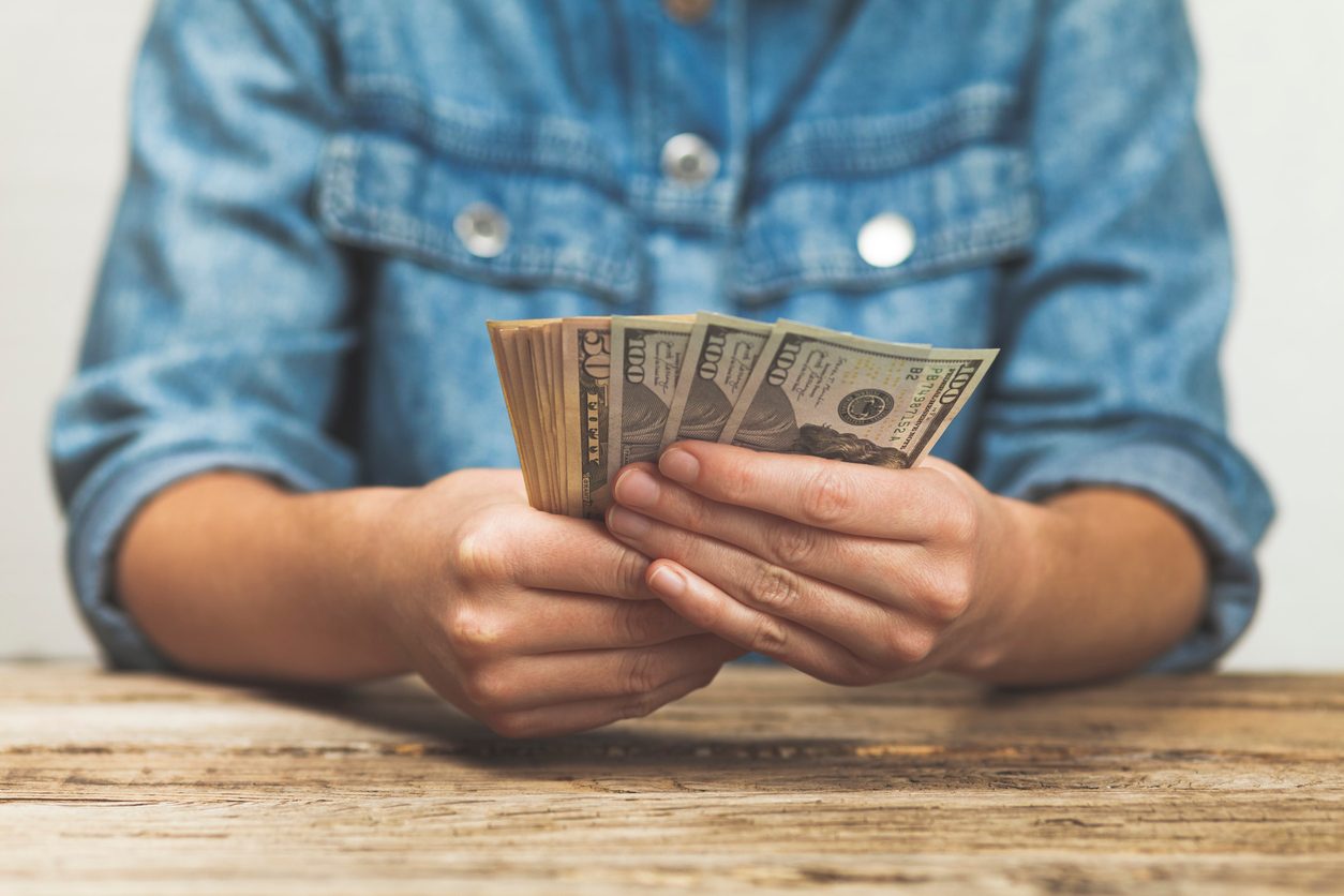 Closeup of a man holding cash in his hands