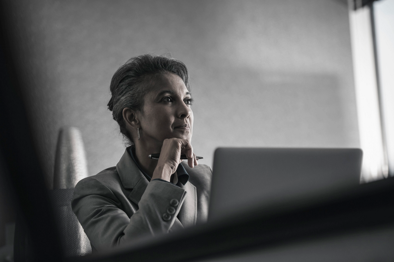 Executive sitting by Laptop