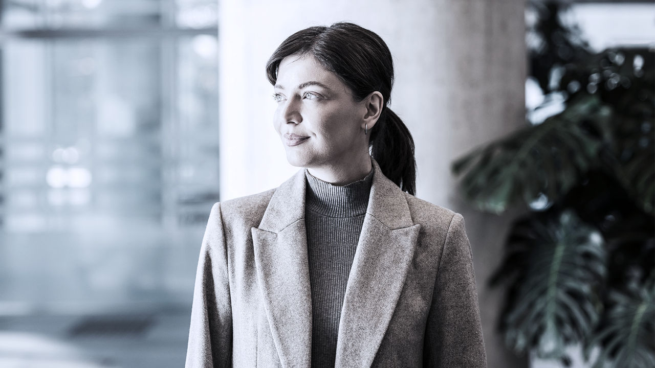Female executive in office looking off in distance