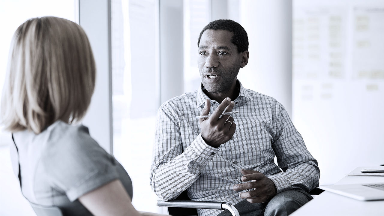 Male executive talking to manager