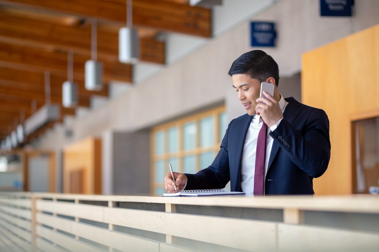 man on cell phone at office
