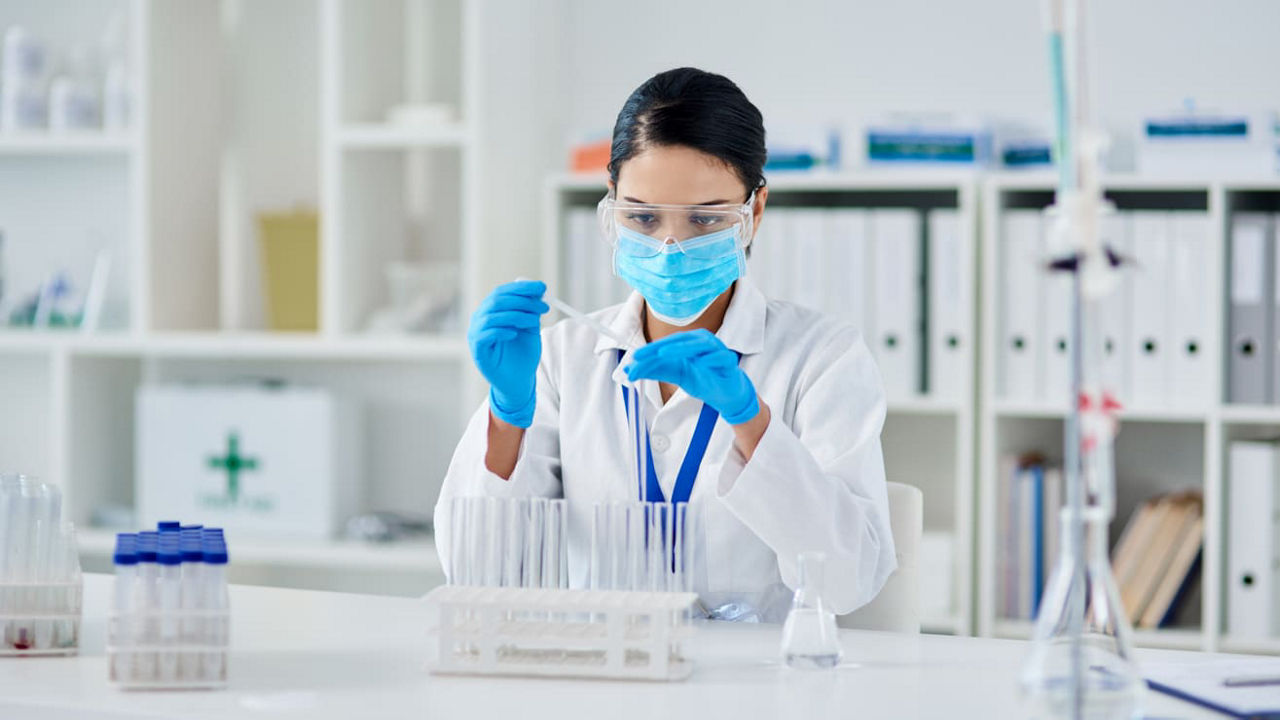 Female chemist working in a laboratory stock photo.