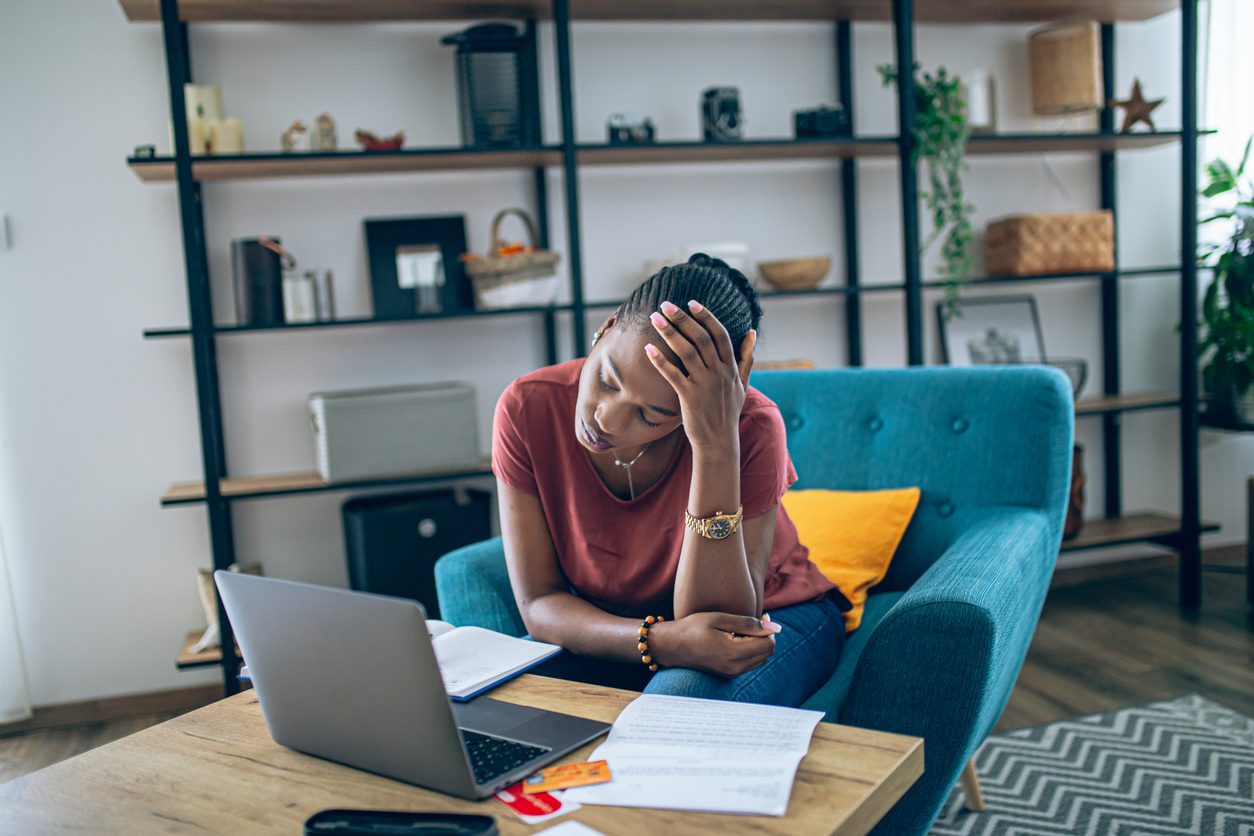 woman looking stressed over finances