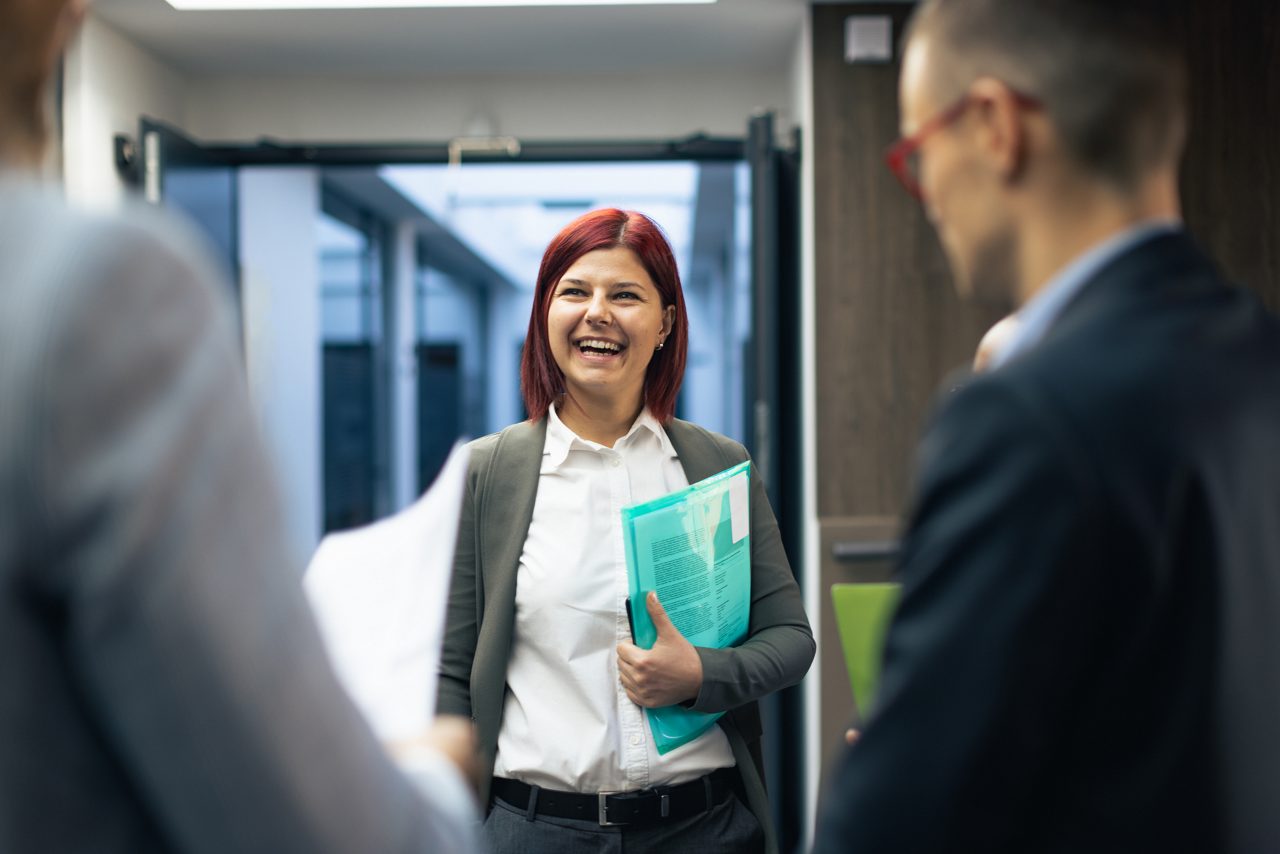 Colleagues greet new employee