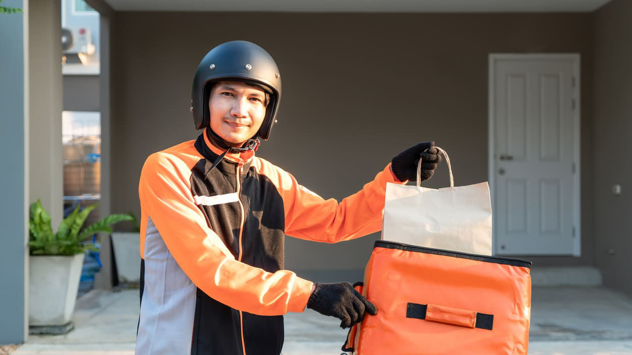 A man holding a delivery box.