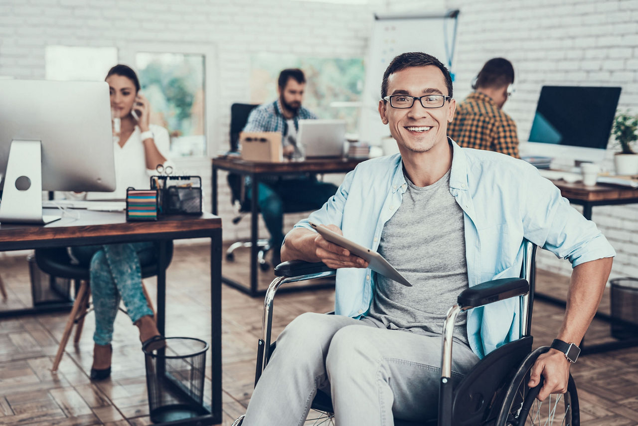 Office worker sitting in wheelchair