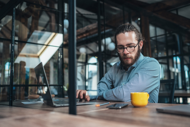 Young businessman working at modern office